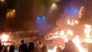 Protesters gather as vehicles burn, amid evolving anti-government unrest, in Tehran, Iran, in this screen grab obtained from a social media video released on 9 January 2026
